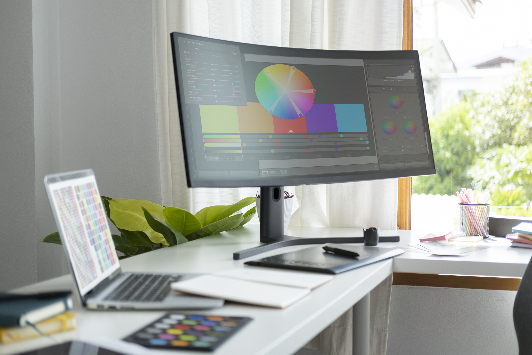 Creative workspace with design software and tools